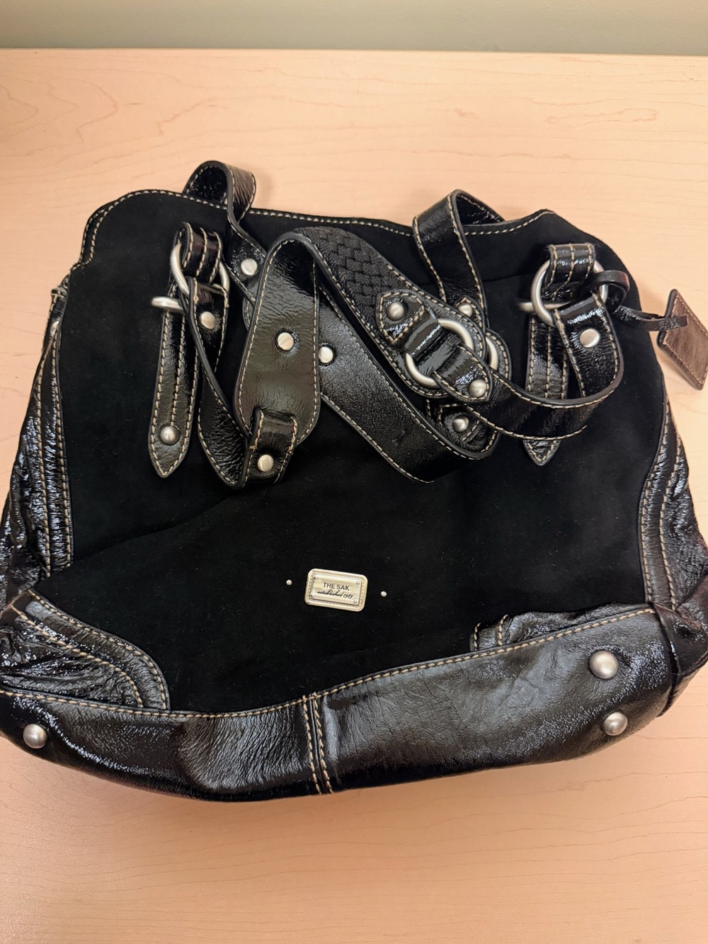 The Sak Black Suede & Leather Shoulder Tote patent leather handles